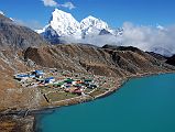 Gokyo 1 2 Gokyo And Gokyo Lake With Cholatse And Taweche Gokyo (4750m) consists of a few lodges between Dudh Pokhari, the beautiful blue third Gokyo Lake, and the lateral moraine of the Ngozumpa glacier. Cholatse and Taweche dominate the view to the east.